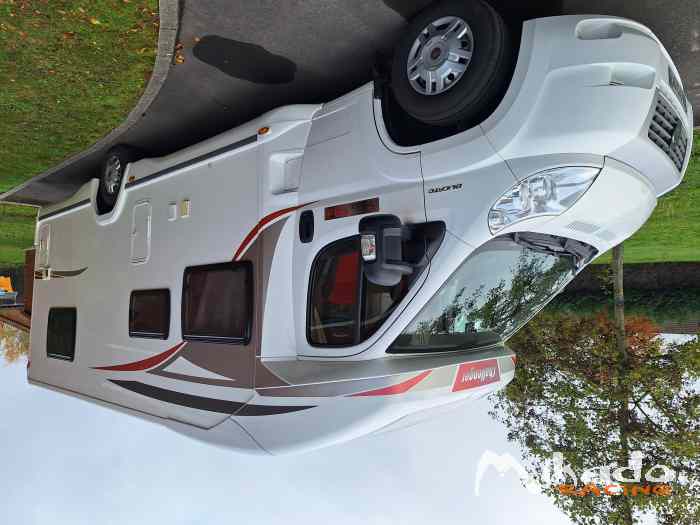 Échange camping car contre voiture de rallye