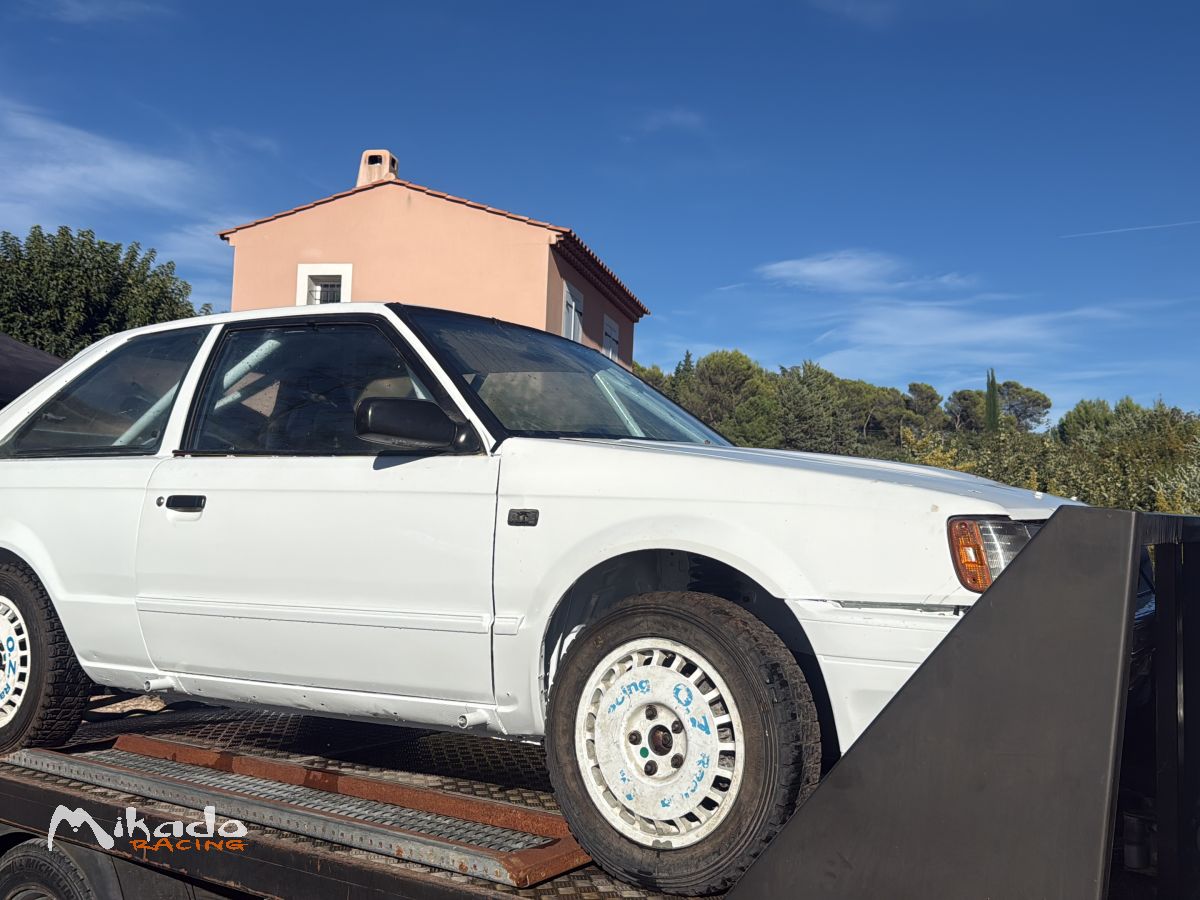 Location Mazda 323 gra terre 2027 – photo 3 sur 3